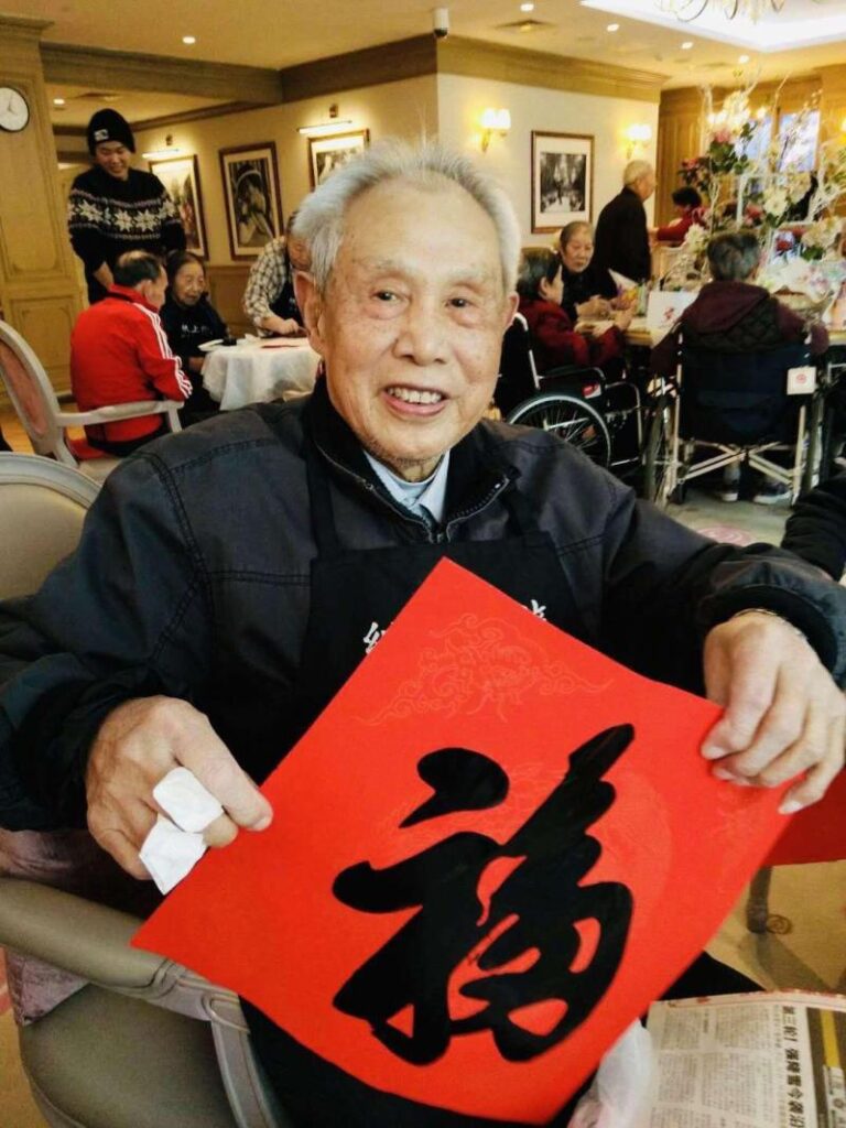 Chinese New Year calligraphy with Orpea residents, image 1 of 4