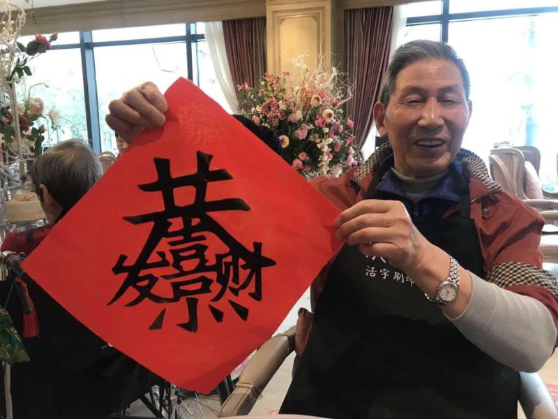 Chinese New Year calligraphy with Orpea residents, image 3 of 4