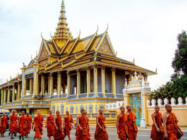 Buddhist monk procession passing by the Royal Palace in Phnom Penh, Cambodia
