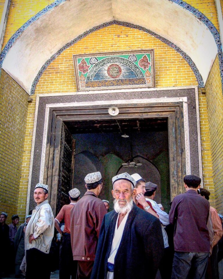 Uyghur believers before the Friday prayer, at the Kashgar Grand Mosque