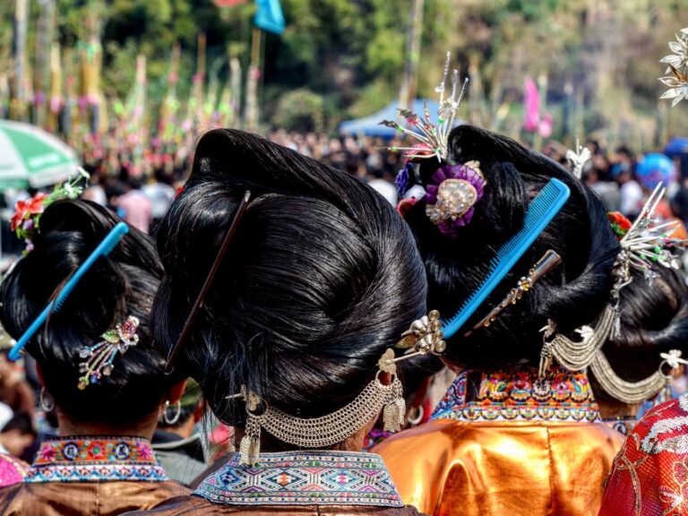 For the yearly Lusheng Competition Festival, Miao women put their hair in beautiful buns, ornamented with…