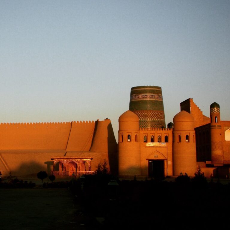 Sunset over the Khiva old town in Uzbekistan, with the KaltaMinor minaret in background