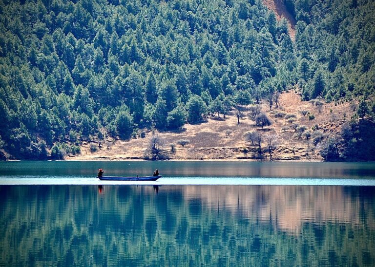 While Mosuo men are mainly fishermen, women have found another boat-related economic activity: they offer…, image 1