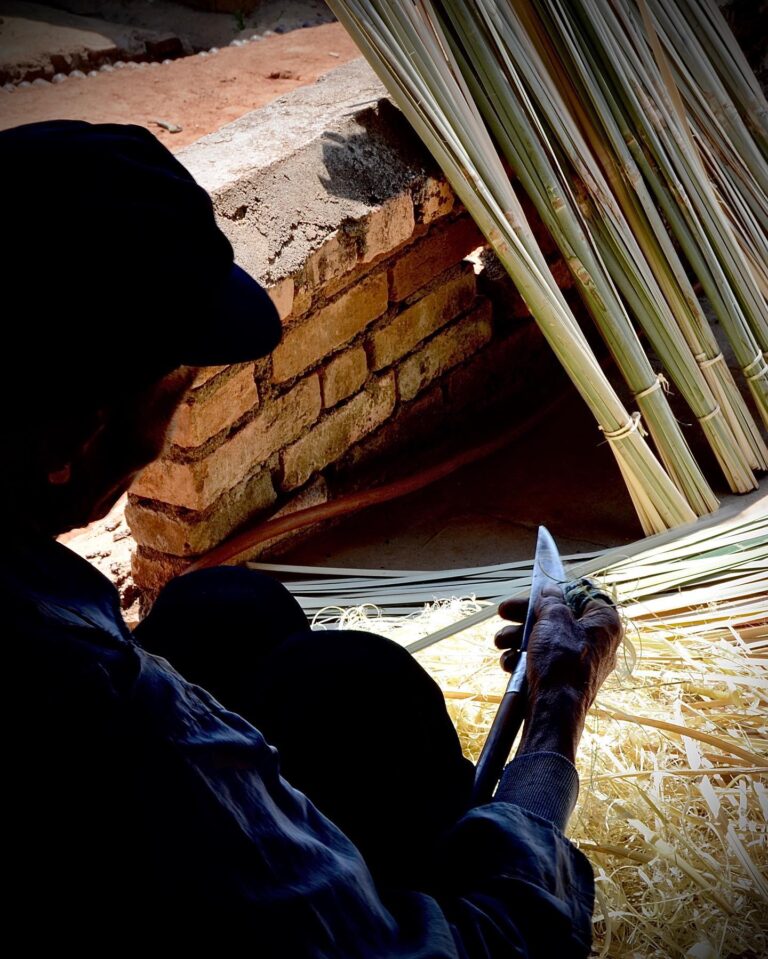 Ake basket maker refining his bamboo strips, image 1