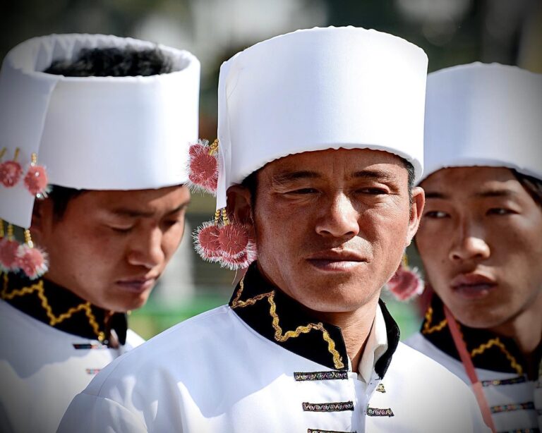 Jingpo sword dancers, from different tribes, each of them recognisable by their different headgear,…, image 1