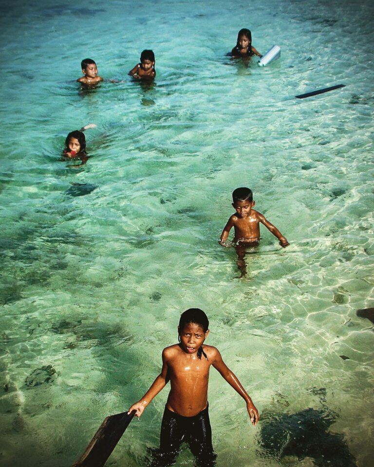 Bajau ("Sea Gypsies") kids intrigued by my camera, near Mabul Island, in the Celebes Sea, Malaysia, image 1