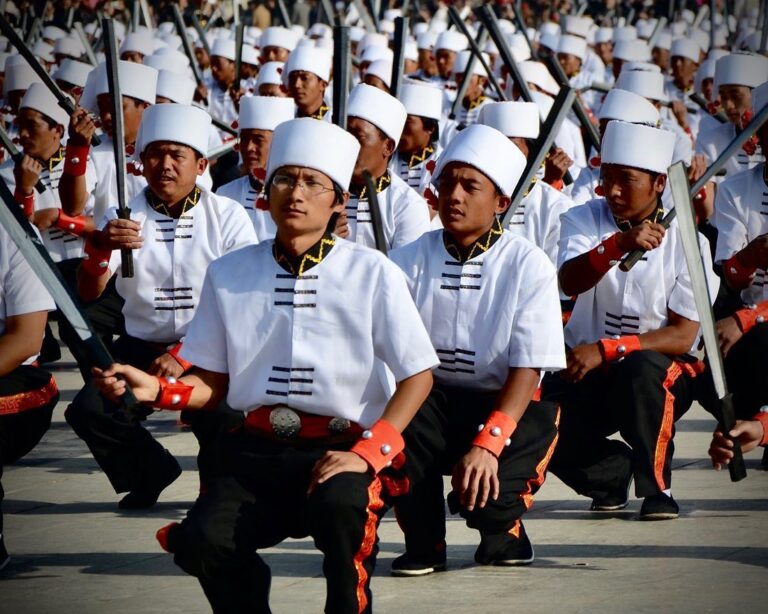One thousand Jingpo men performing the traditional sword dance for the Munao celebration in Dehong, Yunnan…, image 1