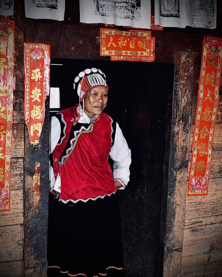 Nu woman, with her typical headgear made of coral pearls and bones