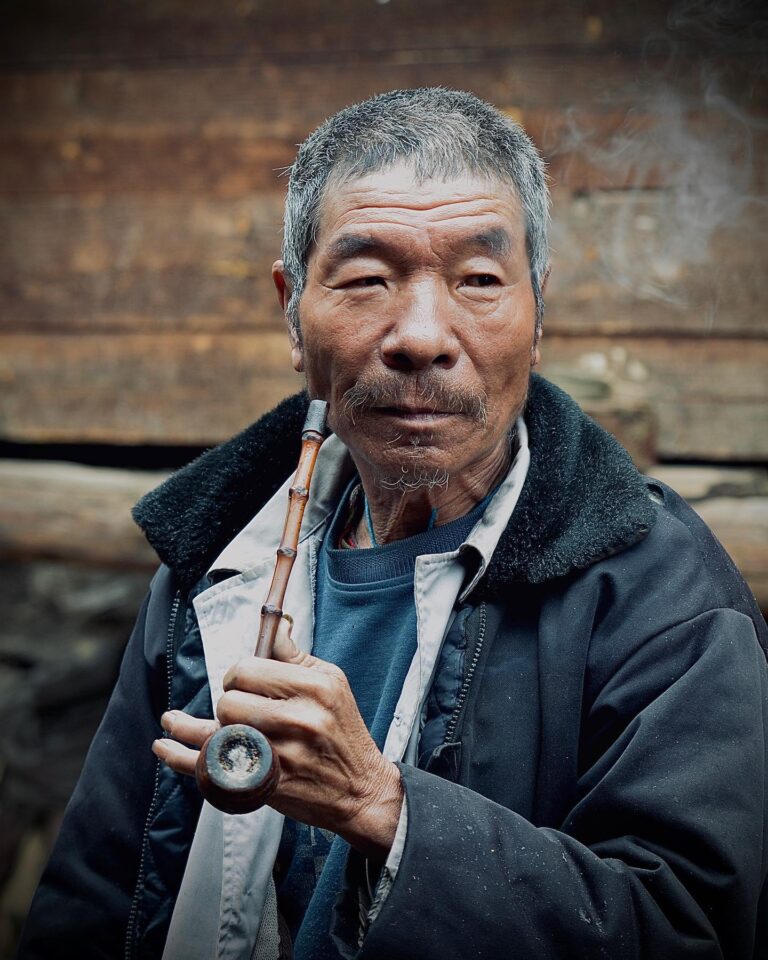 Nu tribe man welcoming me to his home, image 1