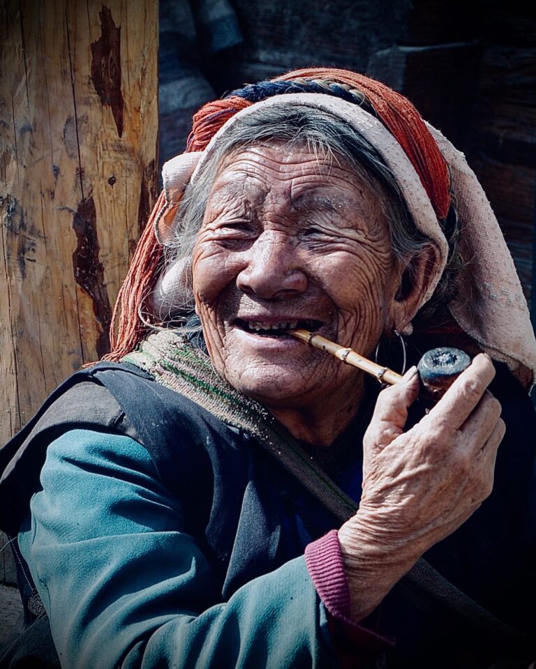 Lisu woman, enjoying smoking her pipe