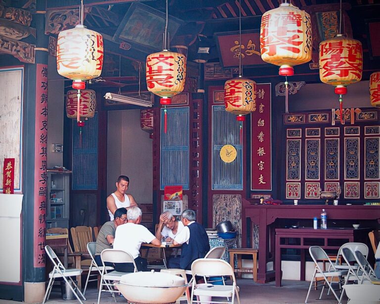 Mah-Jong players, in a shrine dedicated to ancestors, in Kinmen