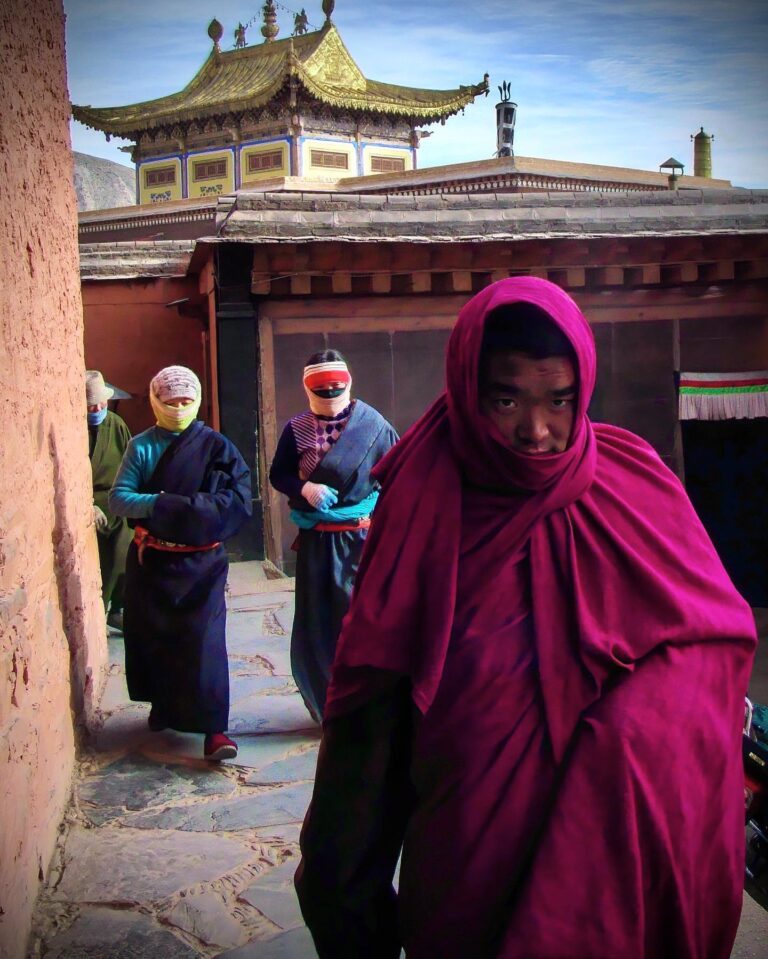 Tibetan believers on their way to the prayer, in Tongren, also known as Repkong in Tibetan, Qinghai…