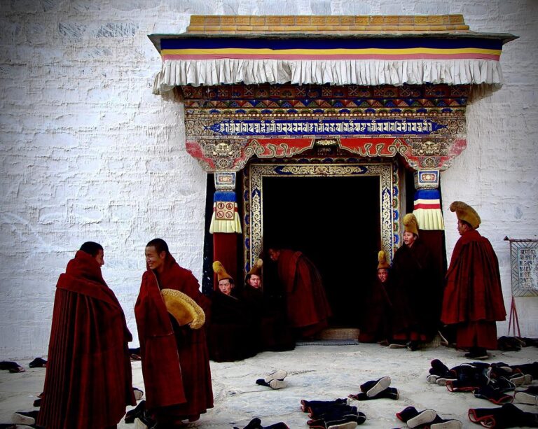 Tibetan Buddhist monks from the yellow-hat Gelugpa sect chatting after their daily prayer at Labrang…