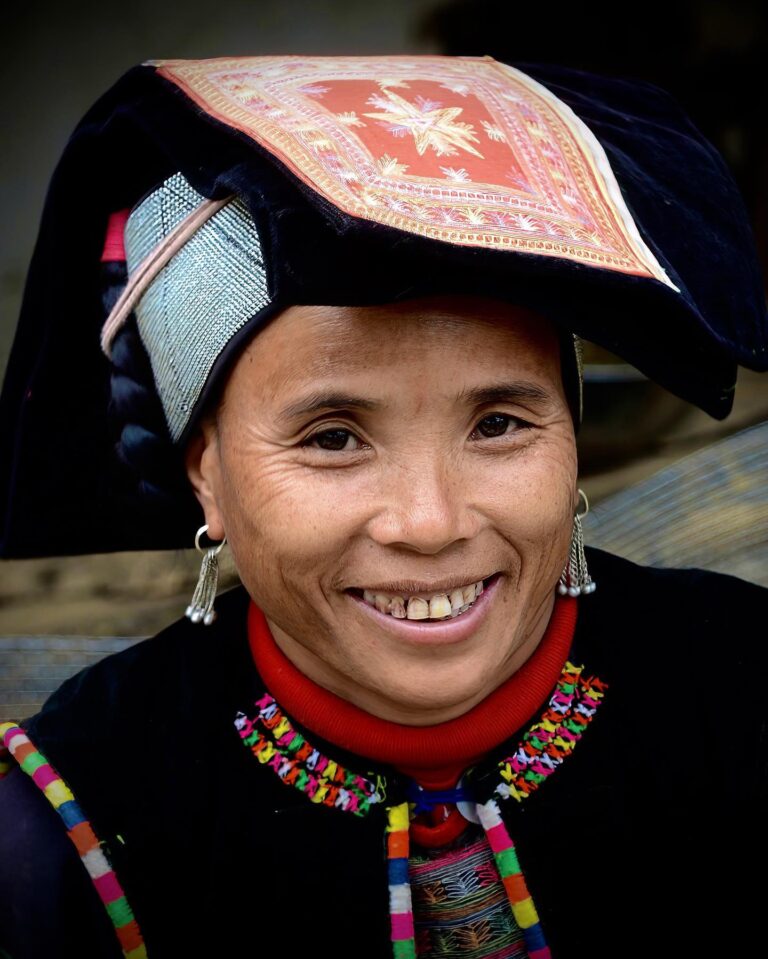 Yi woman, dressed up for the market, in Laomeng, Yunnan, China