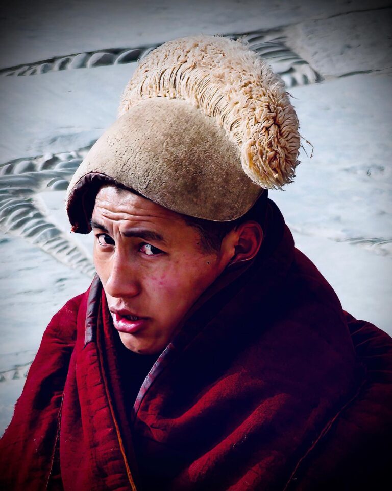 So cold in here! Tibetan Buddhist monk from the yellow-hat Gelugpa sect before the morning prayer at Labrang…