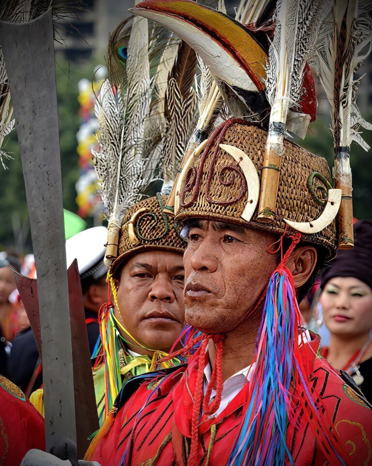 Jingpo tribal chiefs, with their ceremonial headgear made of boar tusks, hornbill heads (carved in wood) and…