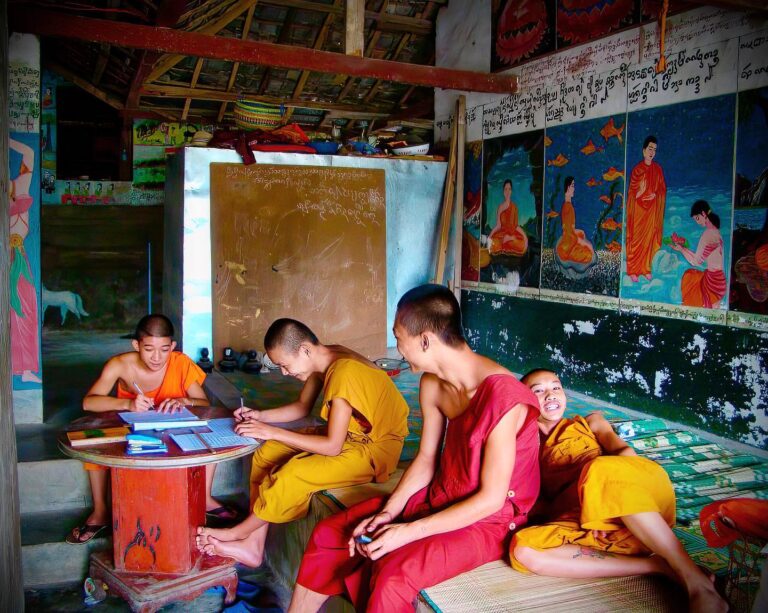 Young Dai Buddhist monks doing their homework, in Xishuang Banna, Yunnan, southwest China