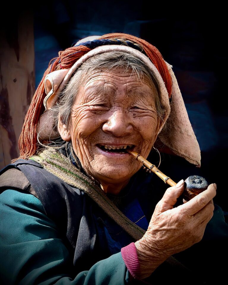 Lisu woman, enjoying smoking her pipe