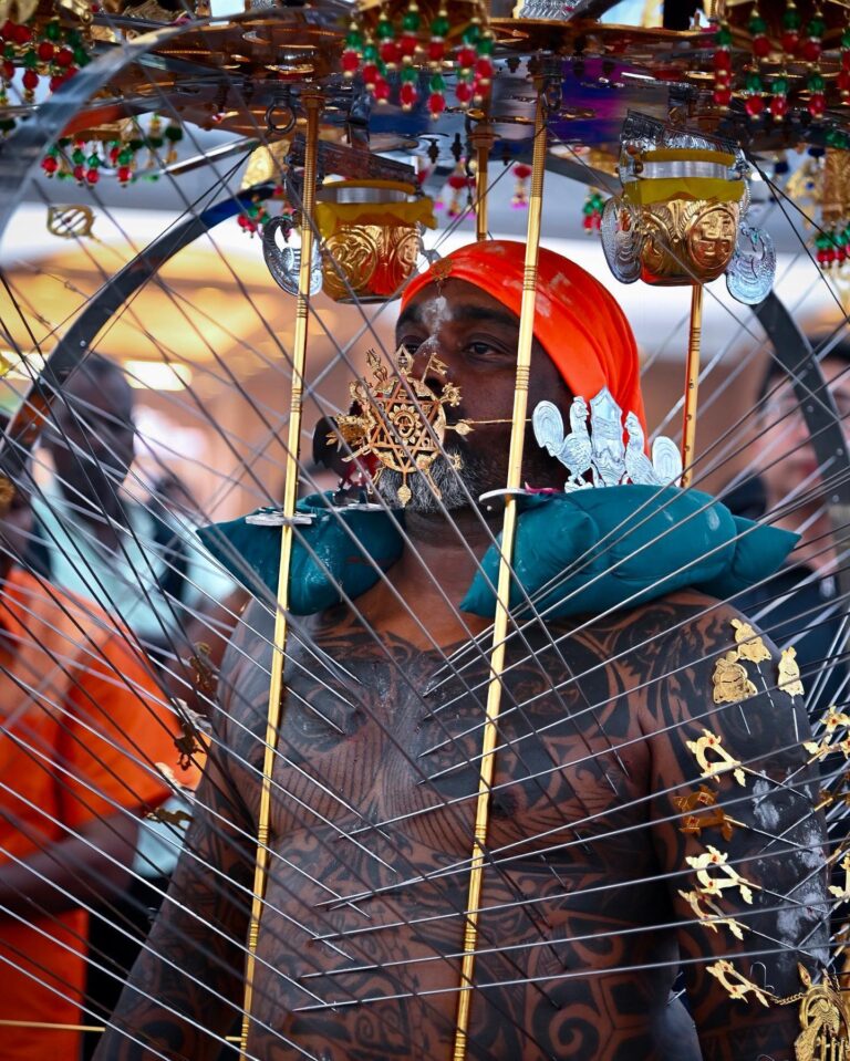 Devotee dancing the Kavadi dance to celebrate Thaipusam in Singapore, image 1