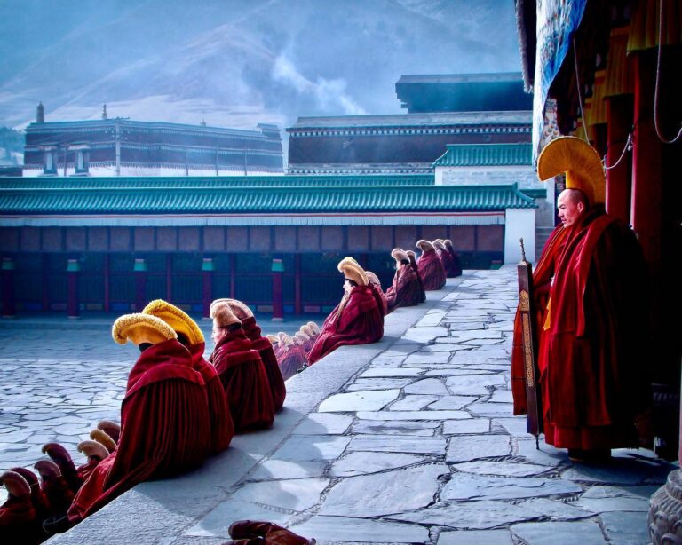 Tibetan Buddhist monks from the yellow-hat Gelugpa sect at the morning prayer at Labrang Monastery, Gansu…
