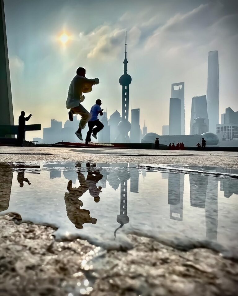 Morning Taichi on the Bund, in Shanghai, with the iconic view of the Pudong Business District skyline