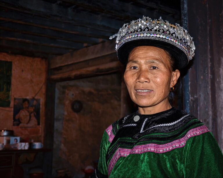 Yi woman from Honghe, Yunnan, wearing an ornamented version of the local turban