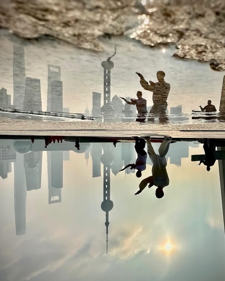 Morning Taichi on the Bund, in Shanghai, with the iconic view of the Pudong Business District skyline