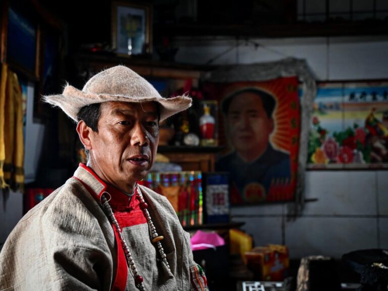 Yingzha Cili, one of the last 11 Great Dongbas in China, wearing his secular outfit