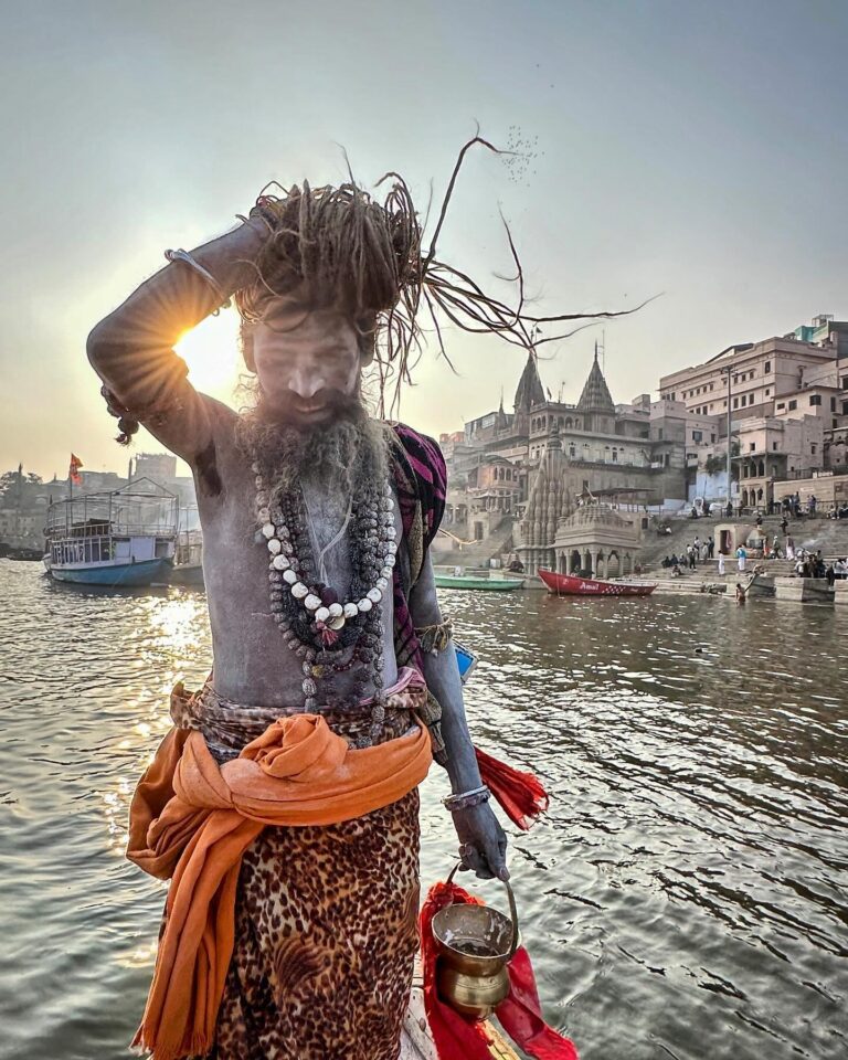Sunset on the Ganges in Varanasi, with a Naga Sadhu, or Naked Sadhu