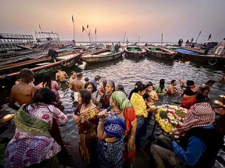 Bathing in the Holy Ganges River at sunrise in Varanasi (Banaras) - sorry for the low-light resolution, image 1