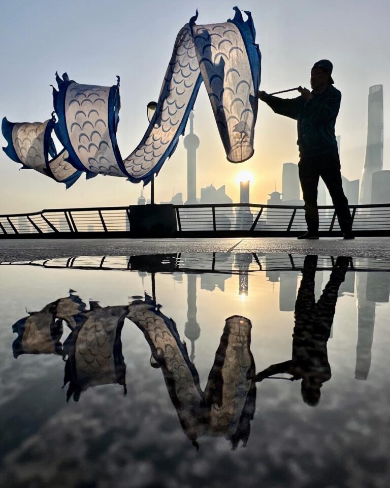 One last pic from this series: the Yin and Yang of the Morning Dragon, on the Bund, with the iconic view of…