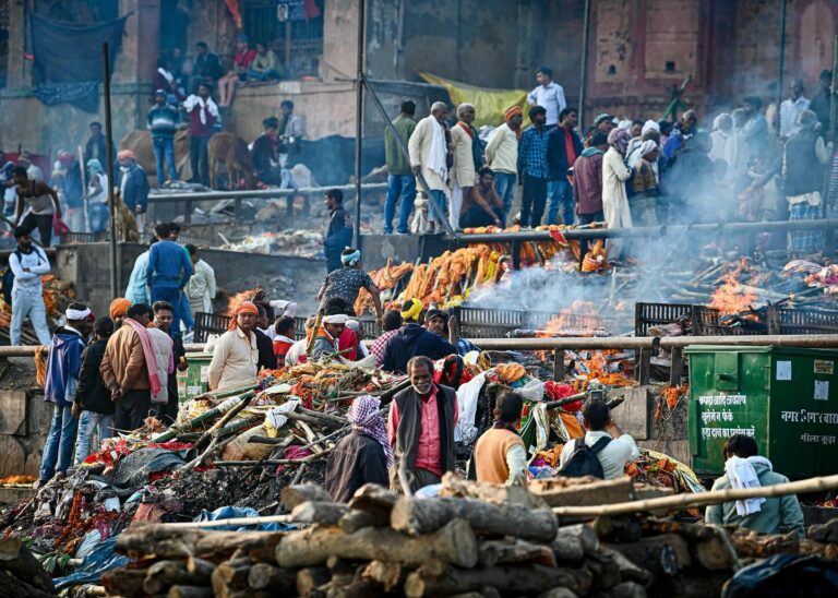 The ghats of Varanasi, particularly Manikarnika Ghat, are known for the ancient and profound ritual of cremation, image 1