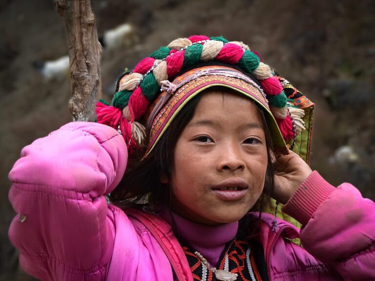 Young girl from the Black Yi ethnic group from Lijiang, near Lugu Lake at the border between the Yunnan and…