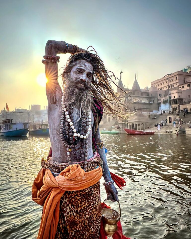 Sunset on the Ganges in Varanasi, with a Naga Sadhu, or Naked Sadhu